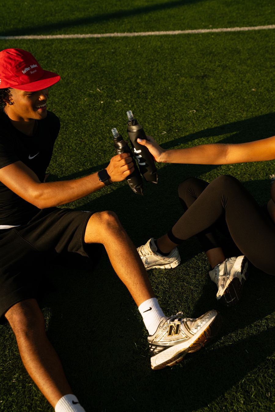 Modern Fuel — cheers with MF flasks on the turf