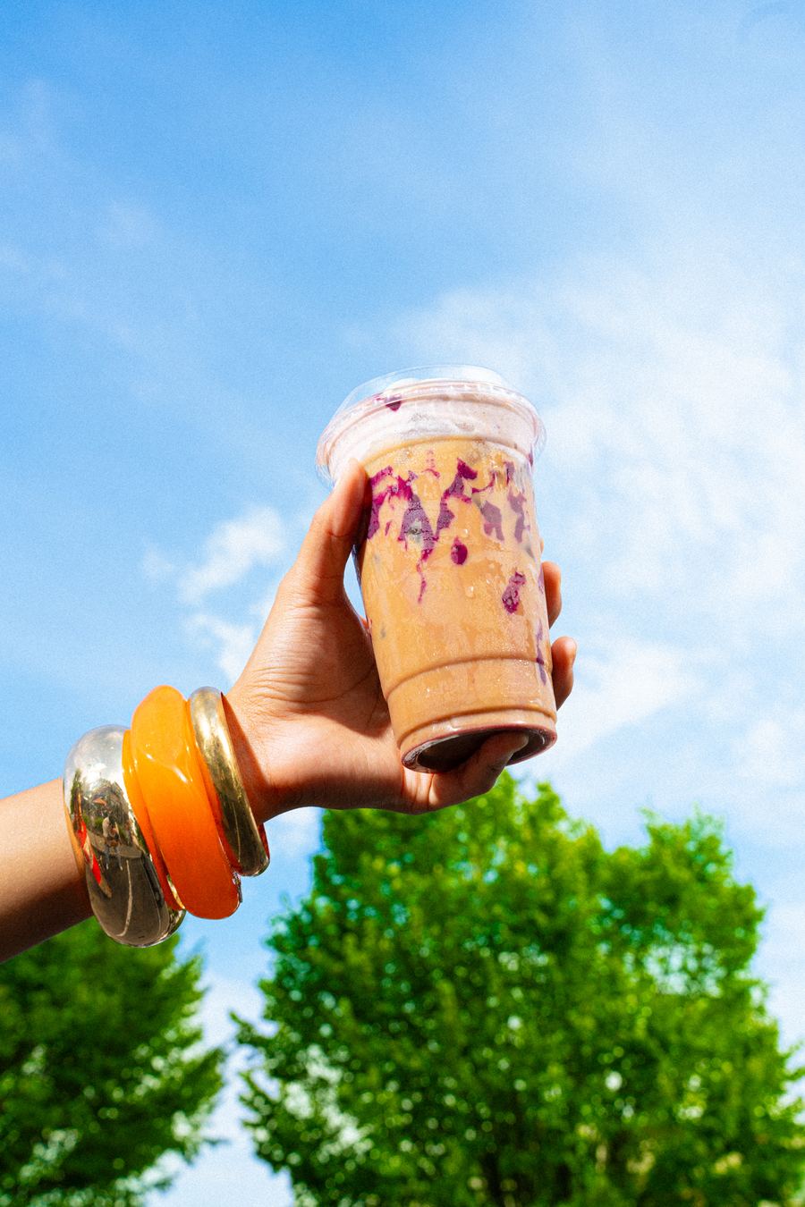 BITE — iced ube latte against the sky