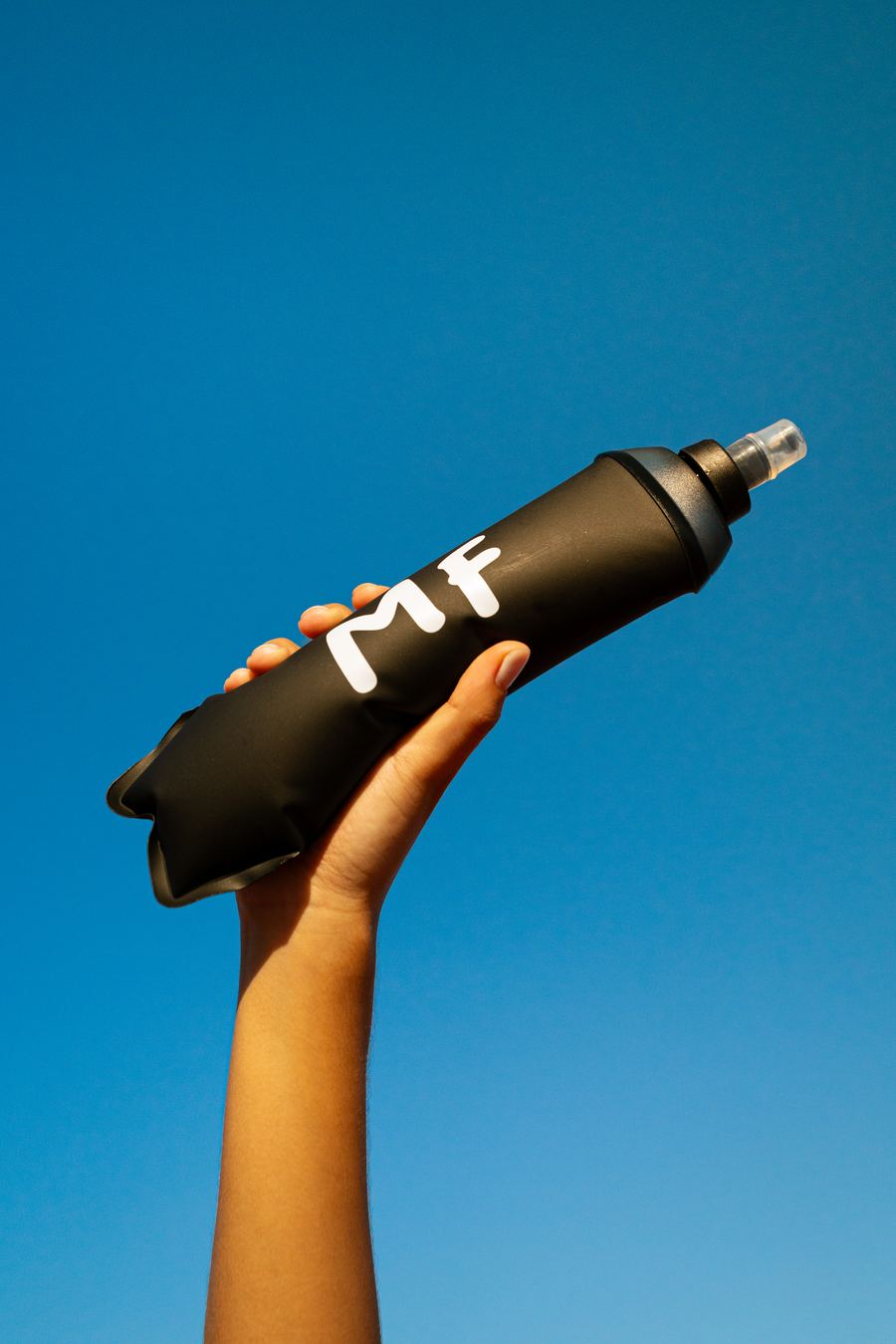Modern Fuel — MF flask held to the sky