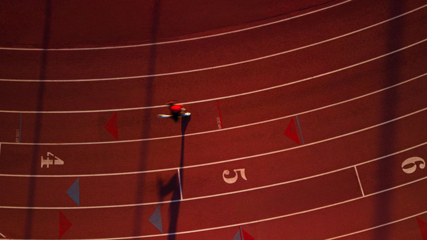 Modern Fuel — aerial of a runner rounding the track