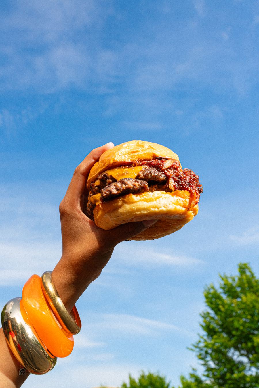 BITE — smash burger against the sky